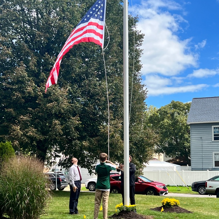 raising flag - bishop Timon